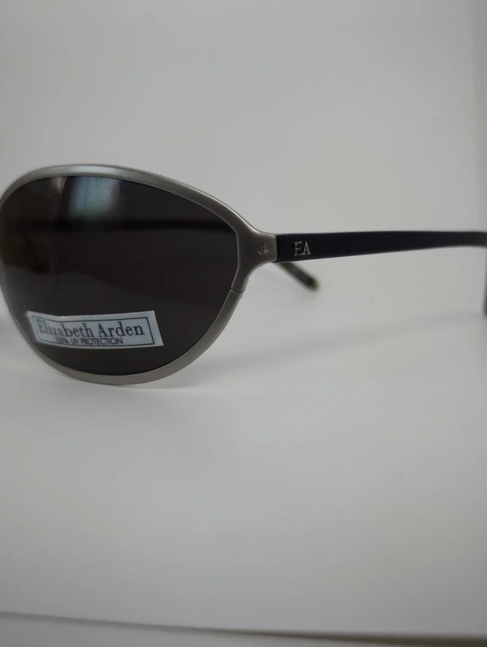 Elizabeth Arden Oval Wrap Sunglasses with Dark Lenses and Silver Frame